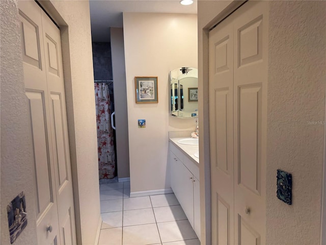 1625 Red Oak Ln, Port Charlotte, FL 33948 - bathroom with a closet, vanity, and tile patterned flooring