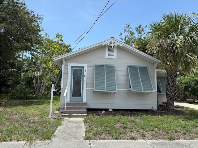 420 W Olympia Ave, Punta Gorda, FL 33950 - view of front facade featuring entry steps and a front yard