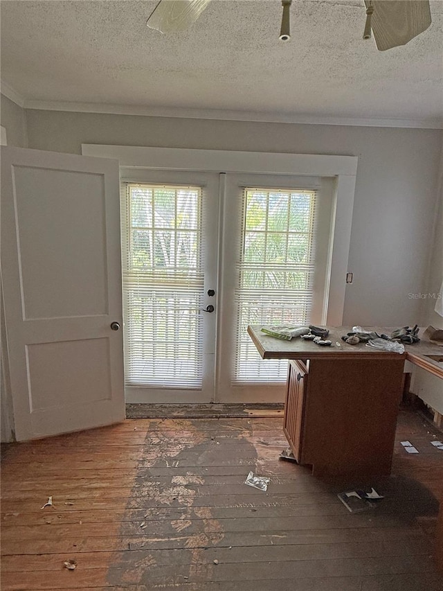 420 W Olympia Ave, Punta Gorda, FL 33950 - entryway featuring wood-type flooring, ornamental molding, a textured ceiling, french doors, and radiator