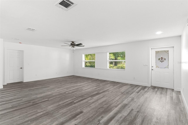 4996 49th St, Vero Beach, FL 32967 - unfurnished living room featuring wood finished floors and ceiling fan