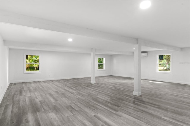 4996 49th St, Vero Beach, FL 32967 - basement featuring wood finished floors, recessed lighting, and a wall unit AC