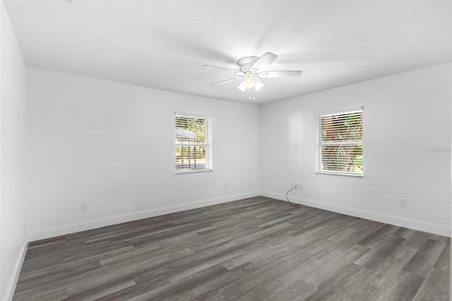 4996 49th St, Vero Beach, FL 32967 - unfurnished room with plenty of natural light, dark wood-style flooring, and a ceiling fan