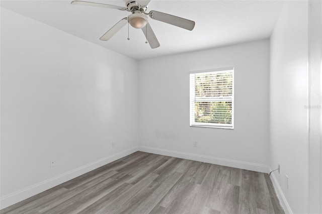 4996 49th St, Vero Beach, FL 32967 - spare room with wood finished floors and ceiling fan