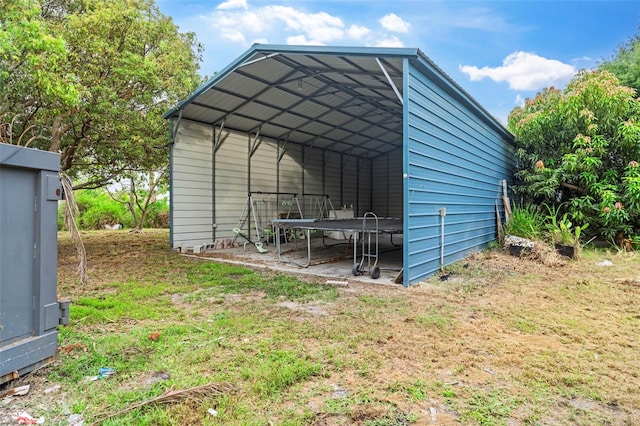 4996 49th St, Vero Beach, FL 32967 - view of outbuilding featuring a trampoline and a detached carport