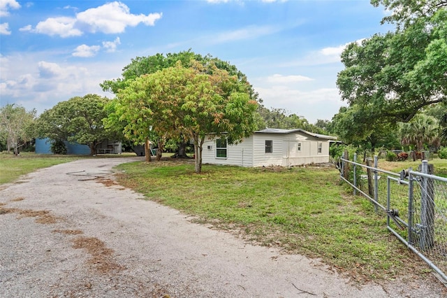 4996 49th St, Vero Beach, FL 32967 - view of home's exterior featuring driveway