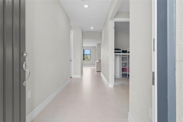 2477 Gabel Oak Dr, North Port, FL 34289 - hallway with light tile patterned floors and recessed lighting