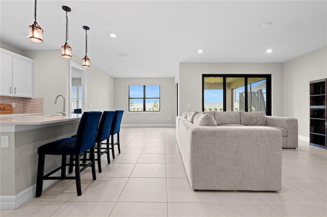 2477 Gabel Oak Dr, North Port, FL 34289 - living room featuring recessed lighting and light tile patterned floors