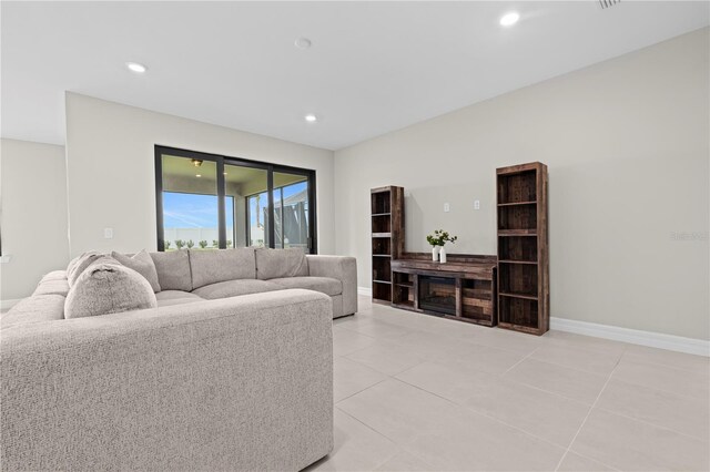2477 Gabel Oak Dr, North Port, FL 34289 - living area featuring light tile patterned floors and recessed lighting