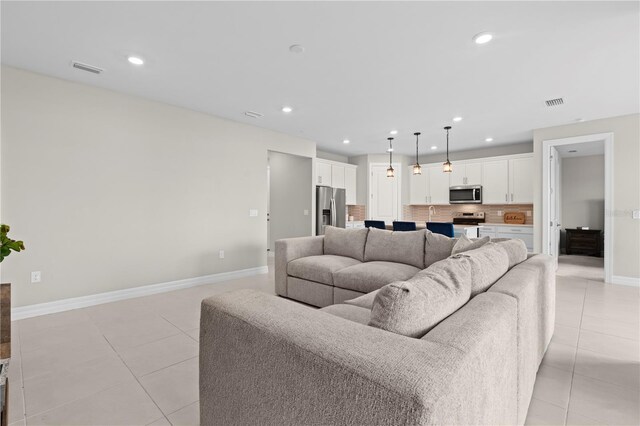 2477 Gabel Oak Dr, North Port, FL 34289 - living area with light tile patterned floors and recessed lighting
