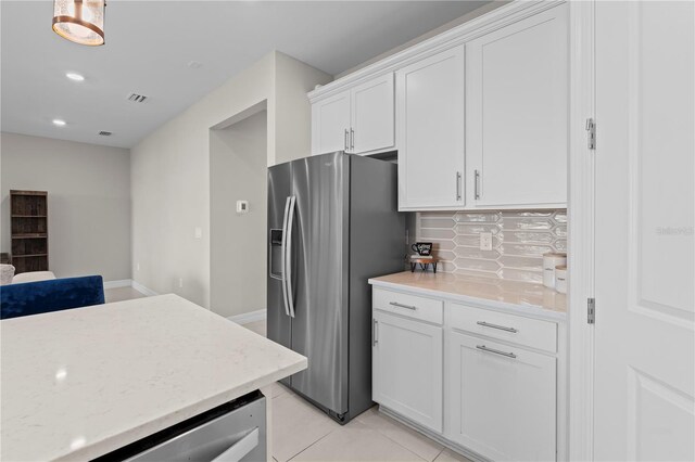 2477 Gabel Oak Dr, North Port, FL 34289 - kitchen featuring appliances with stainless steel finishes, white cabinets, backsplash, recessed lighting, and light stone countertops