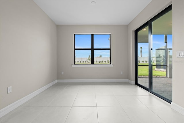 2477 Gabel Oak Dr, North Port, FL 34289 - empty room with baseboards and light tile patterned flooring