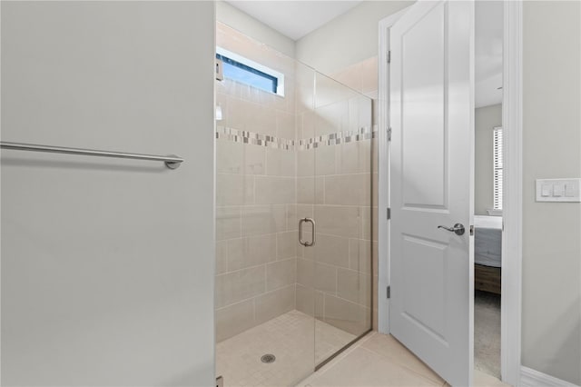 2477 Gabel Oak Dr, North Port, FL 34289 - ensuite bathroom featuring a stall shower and tile patterned flooring