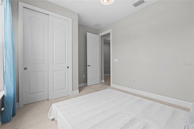 2477 Gabel Oak Dr, North Port, FL 34289 - bedroom featuring light colored carpet and a closet