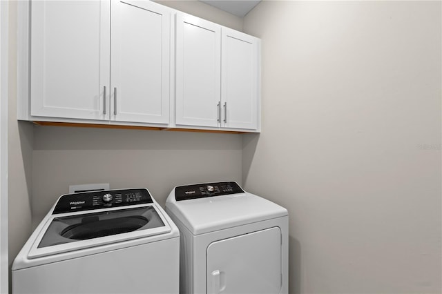 2477 Gabel Oak Dr, North Port, FL 34289 - washroom featuring cabinet space and washer and dryer