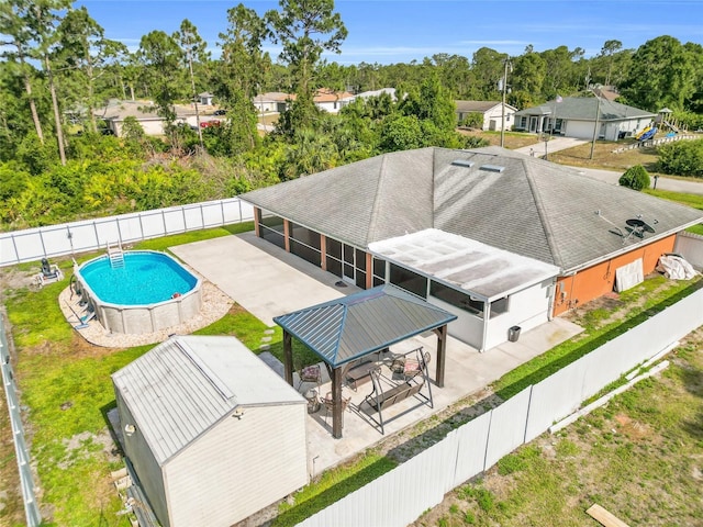 3010 52nd St W, Lehigh Acres, FL 33971 - drone / aerial view of a pool area and a tree filled landscape