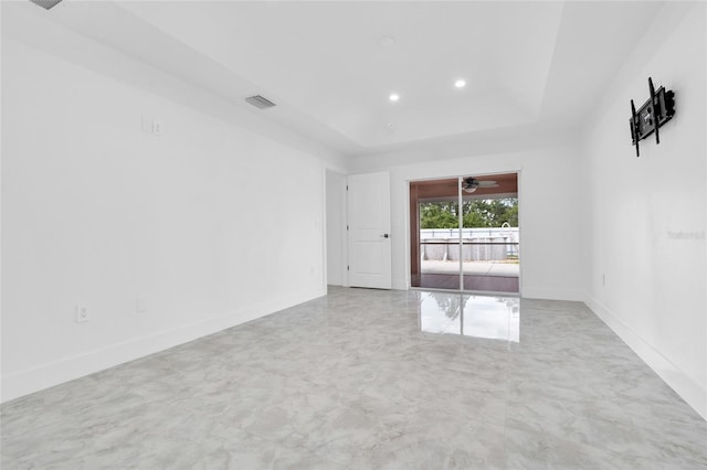 3010 52nd St W, Lehigh Acres, FL 33971 - empty room featuring a tray ceiling, recessed lighting, and a ceiling fan