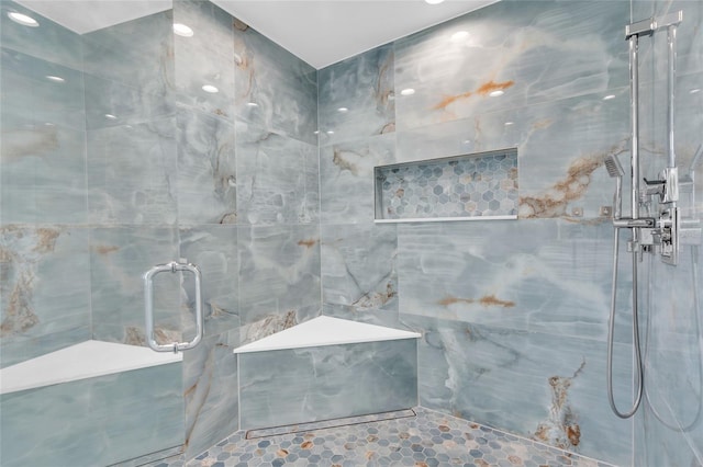 3010 52nd St W, Lehigh Acres, FL 33971 - bathroom with a marble finish shower and tile walls
