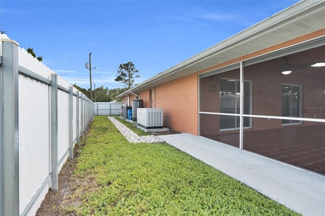 3010 52nd St W, Lehigh Acres, FL 33971 - fenced backyard featuring ceiling fan and a patio