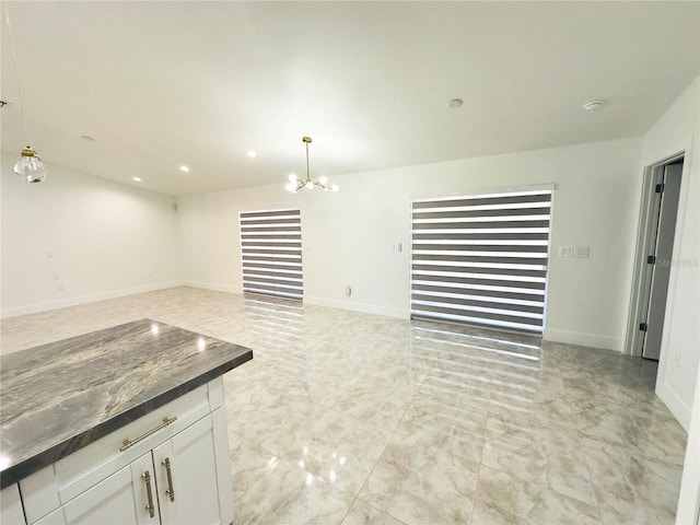 3010 52nd St W, Lehigh Acres, FL 33971 - unfurnished living room with a chandelier and recessed lighting