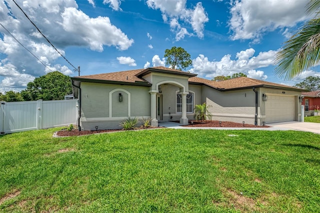 4038 Corydon Ave, North Port, FL 34286 - mediterranean / spanish house featuring stucco siding, a garage, concrete driveway, and a gate