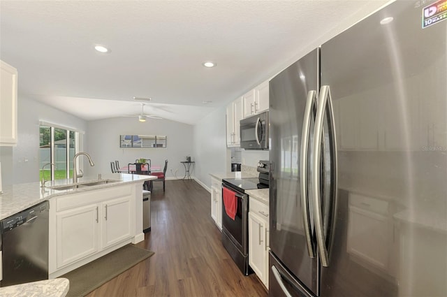 4038 Corydon Ave, North Port, FL 34286 - kitchen with freestanding refrigerator, dishwashing machine, electric range, lofted ceiling, and dark wood finished floors