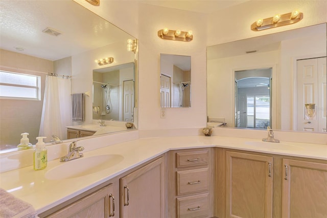 4038 Corydon Ave, North Port, FL 34286 - bathroom featuring double vanity and curtained shower