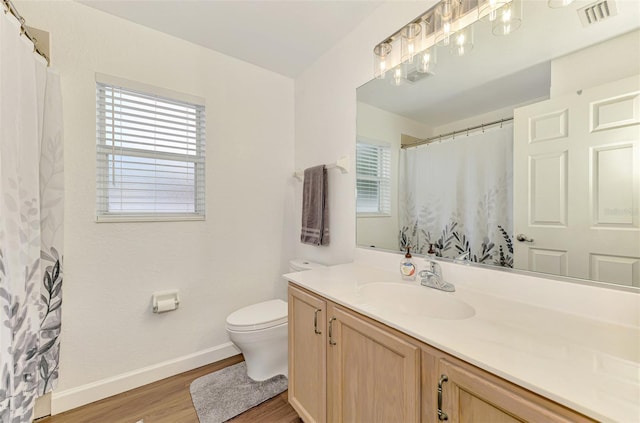 4038 Corydon Ave, North Port, FL 34286 - full bath with wood finished floors, vanity, and plenty of natural light