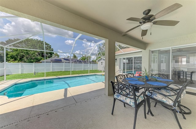 4038 Corydon Ave, North Port, FL 34286 - view of swimming pool featuring a patio, ceiling fan, a shed, a lanai, and outdoor dining area