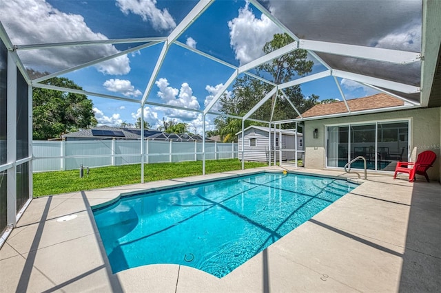 4038 Corydon Ave, North Port, FL 34286 - view of pool featuring a storage unit, a patio area, a fenced backyard, and glass enclosure