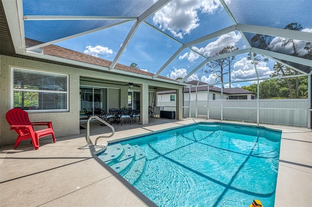 4038 Corydon Ave, North Port, FL 34286 - view of swimming pool featuring a patio area, a ceiling fan, and a lanai