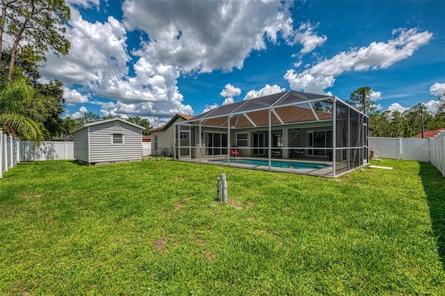 4038 Corydon Ave, North Port, FL 34286 - rear view of house featuring a fenced backyard, glass enclosure, and a shed