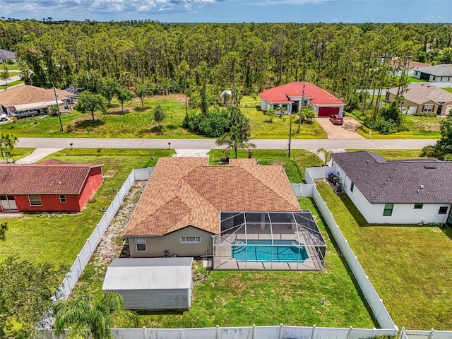 4038 Corydon Ave, North Port, FL 34286 - aerial perspective of suburban area with a pool area and a forest