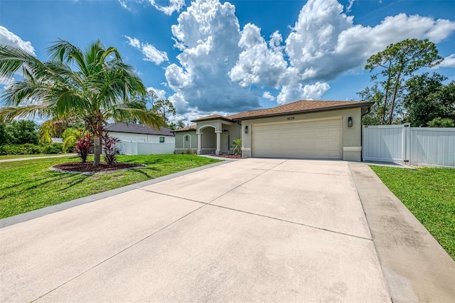 4038 Corydon Ave, North Port, FL 34286 - mediterranean / spanish house featuring stucco siding, driveway, an attached garage, and a gate