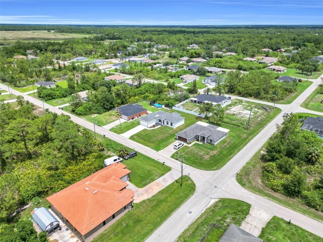 3202 41st St W, Lehigh Acres, FL 33971 - aerial perspective of suburban area featuring a heavily wooded area