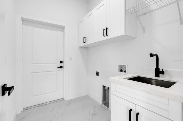 3202 41st St W, Lehigh Acres, FL 33971 - laundry room with cabinet space, hookup for a washing machine, light marble finish floors, and electric dryer hookup