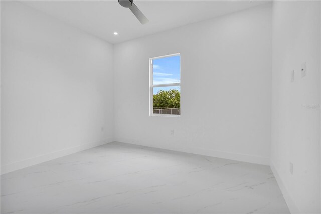 3202 41st St W, Lehigh Acres, FL 33971 - spare room with light marble finish floors, ceiling fan, and recessed lighting