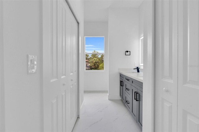 3202 41st St W, Lehigh Acres, FL 33971 - bathroom featuring marble look tile flooring and vanity
