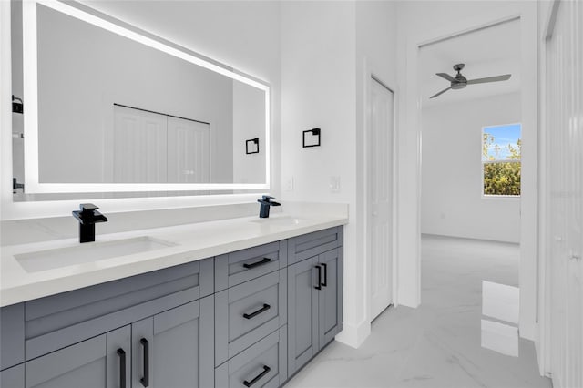 3202 41st St W, Lehigh Acres, FL 33971 - bathroom featuring marble look tiles, double vanity, ceiling fan, and a closet