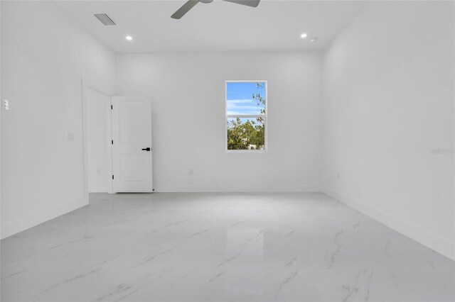 3202 41st St W, Lehigh Acres, FL 33971 - empty room featuring marble finish floors, recessed lighting, and a ceiling fan
