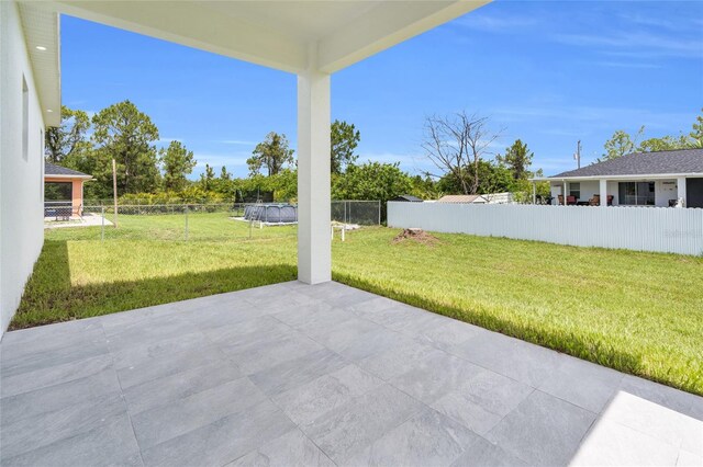 3202 41st St W, Lehigh Acres, FL 33971 - fenced backyard with a patio