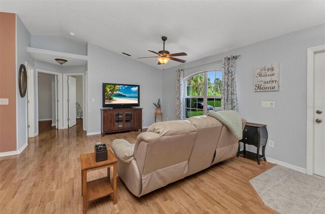 3305 Nansen Ln, North Port, FL 34286 - living room featuring lofted ceiling, light wood-type flooring, and a ceiling fan