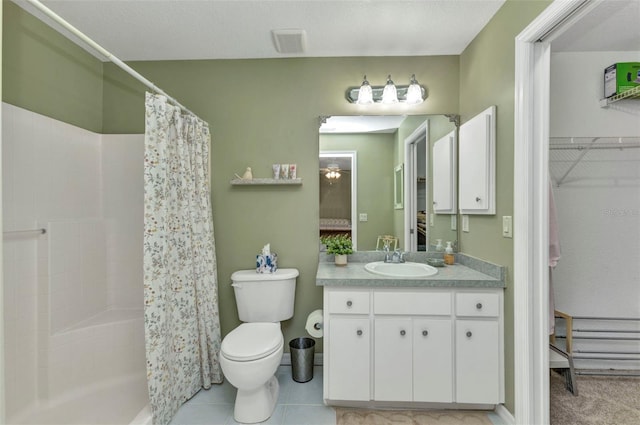 3305 Nansen Ln, North Port, FL 34286 - bathroom featuring vanity, curtained shower, and a walk in closet