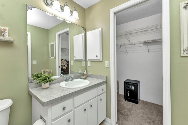 3305 Nansen Ln, North Port, FL 34286 - bathroom with vanity and a walk in closet