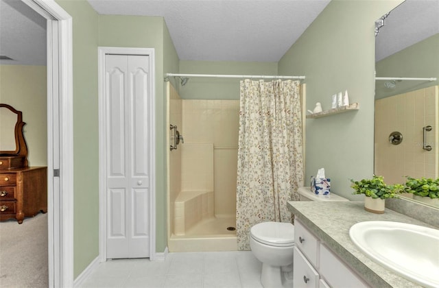 3305 Nansen Ln, North Port, FL 34286 - bathroom featuring vanity, a tile shower, a textured ceiling, tile patterned flooring, and a closet