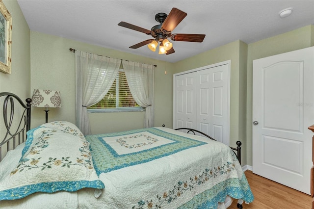 3305 Nansen Ln, North Port, FL 34286 - bedroom with wood finished floors, a closet, and a ceiling fan