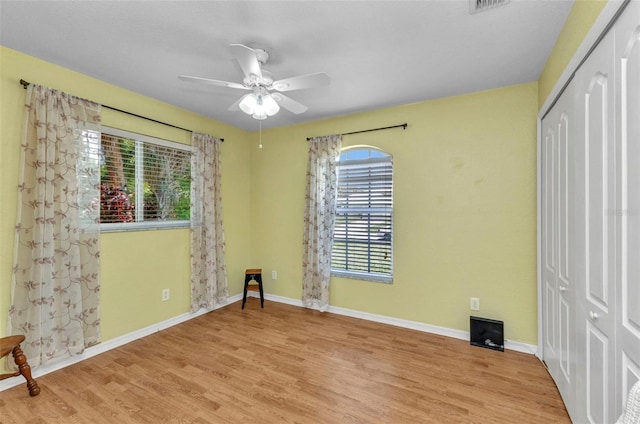 3305 Nansen Ln, North Port, FL 34286 - unfurnished bedroom featuring a closet, wood finished floors, and a ceiling fan