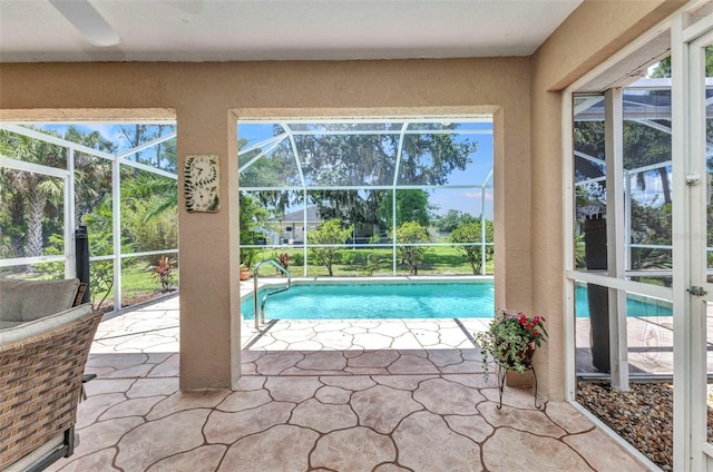 3305 Nansen Ln, North Port, FL 34286 - swimming pool with a patio, glass enclosure, and a ceiling fan