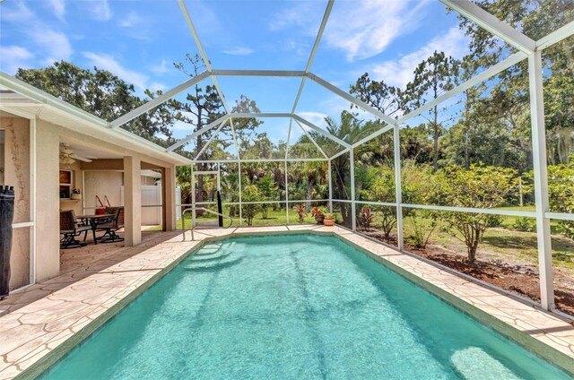 3305 Nansen Ln, North Port, FL 34286 - outdoor pool featuring a patio area, a lanai, and ceiling fan