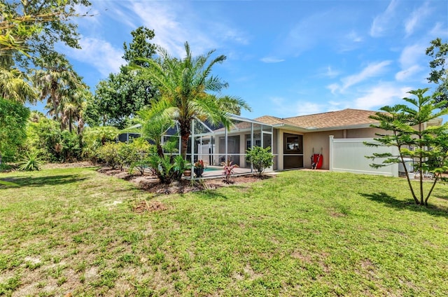 3305 Nansen Ln, North Port, FL 34286 - view of front of home with a front lawn, stucco siding, and glass enclosure