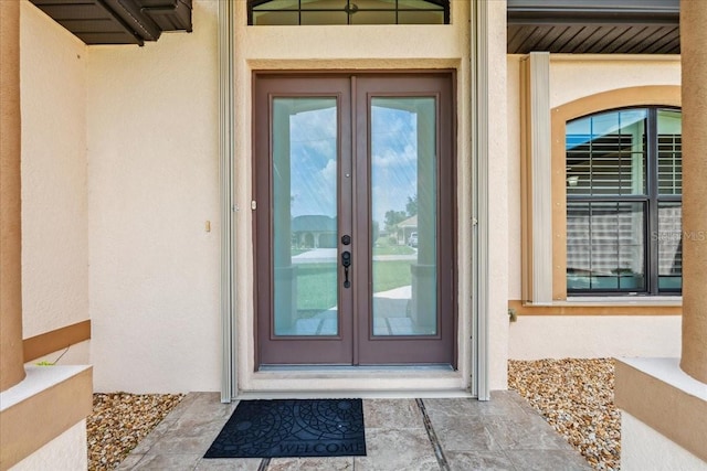 1275 Blue Lake Cir, Punta Gorda, FL 33983 - entrance to property with french doors and stucco siding